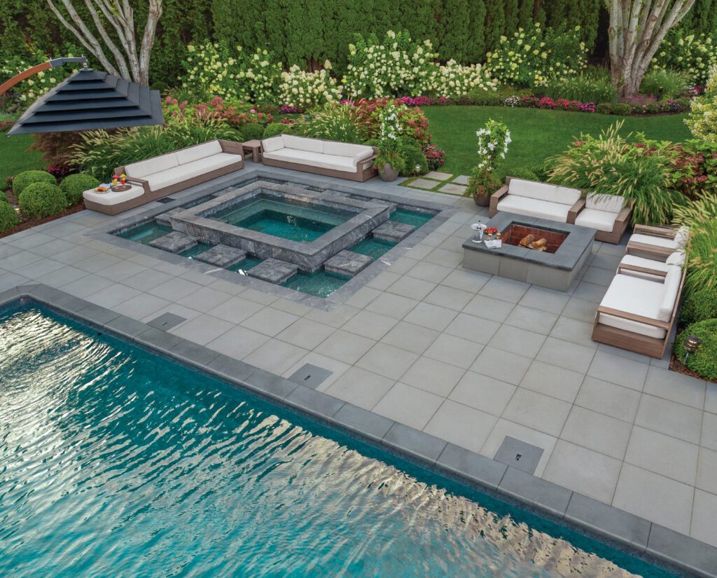 backyard with outdoor seating, cocktail pool with bar, paver patio, and larger pool