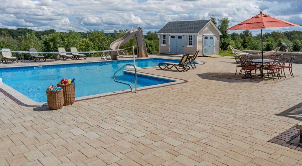 Water slide on a flagstone pool patio